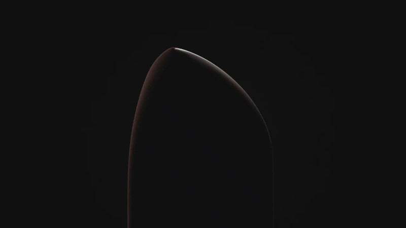 True Velvet lipsticks rotating across the scene, in and out of the light