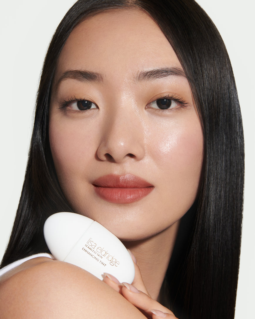 Close up portrait of model wearing and holding T6