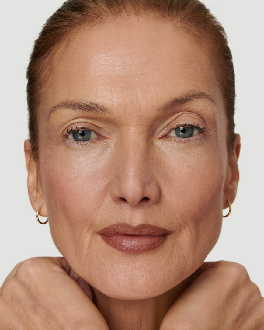 Portrait close-up of model wearing 1N Sculpt and Shade Lip Pencil 