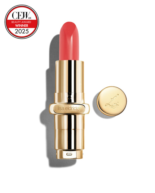 Salmon pink coloured lipstick with gold casing and 'Lisa Eldridge' branding on a white background, featuring a CEW Beauty Award 2025 badge.