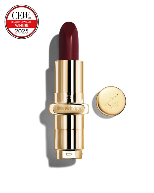 Deep claret coloured lipstick with gold casing and 'Lisa Eldridge' branding on a white background, featuring a CEW Beauty Award 2025 badge.
