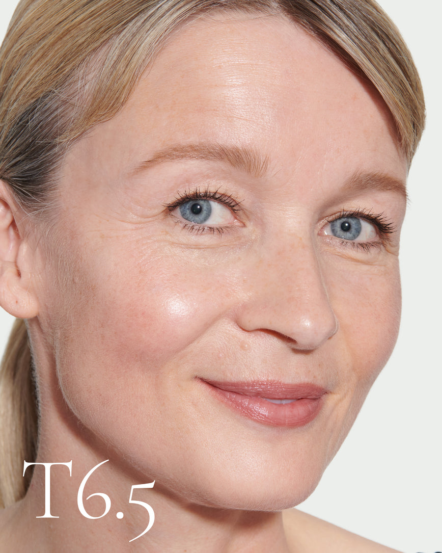 Close up portrait of model wearing T6.5 with text displaying so