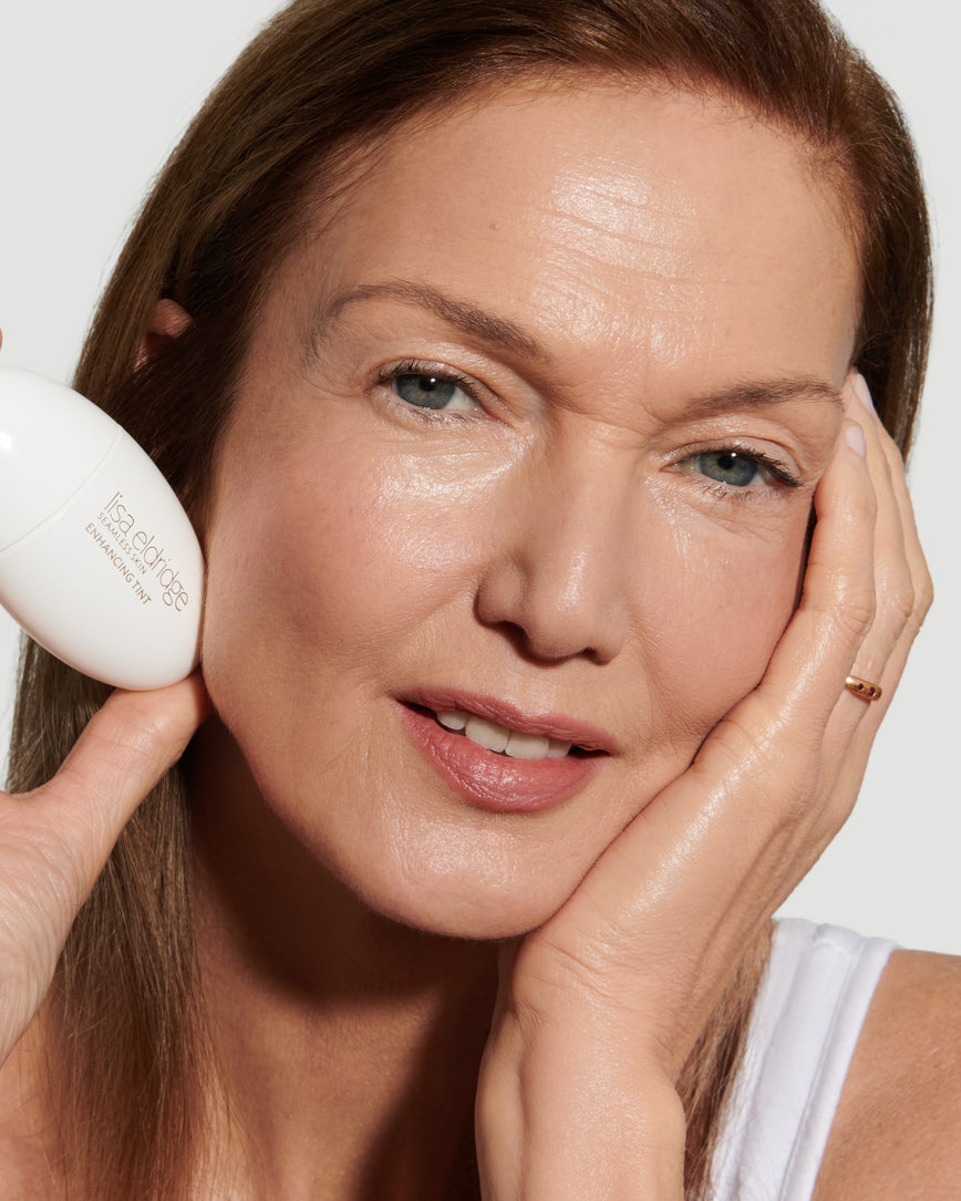 Close up portrait of model wearing and holding T7