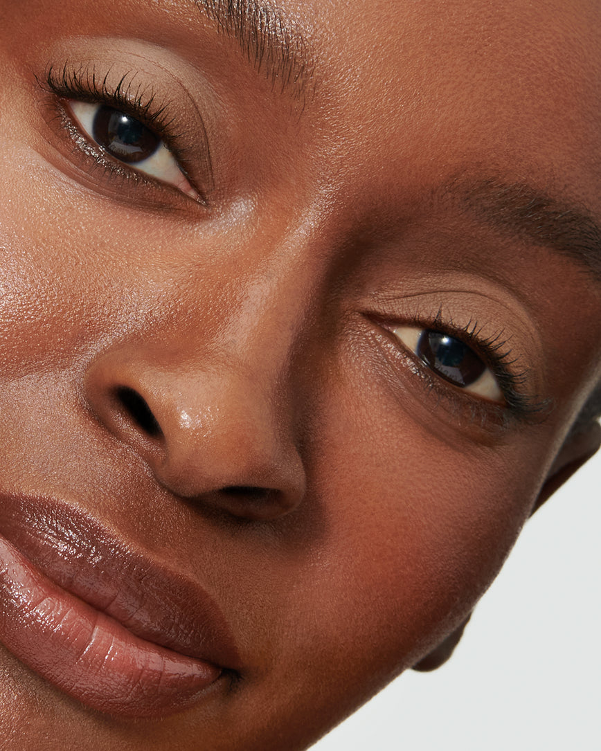 Portrait close-up of model wearing mauve beige Pheobe Liquid Silk eyeshadow