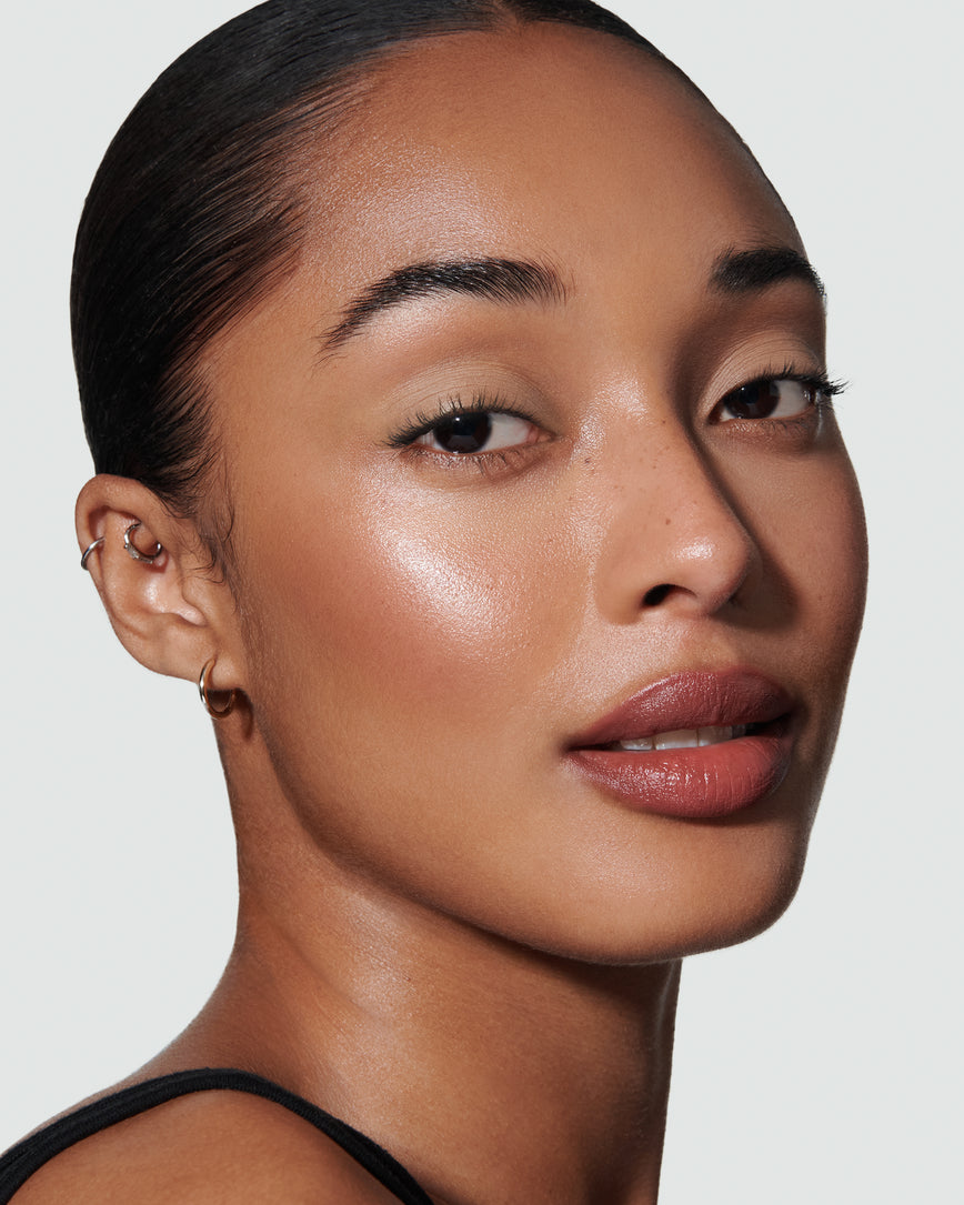 Portrait close-up of model wearing mauve beige Pheobe Liquid Silk eyeshadow