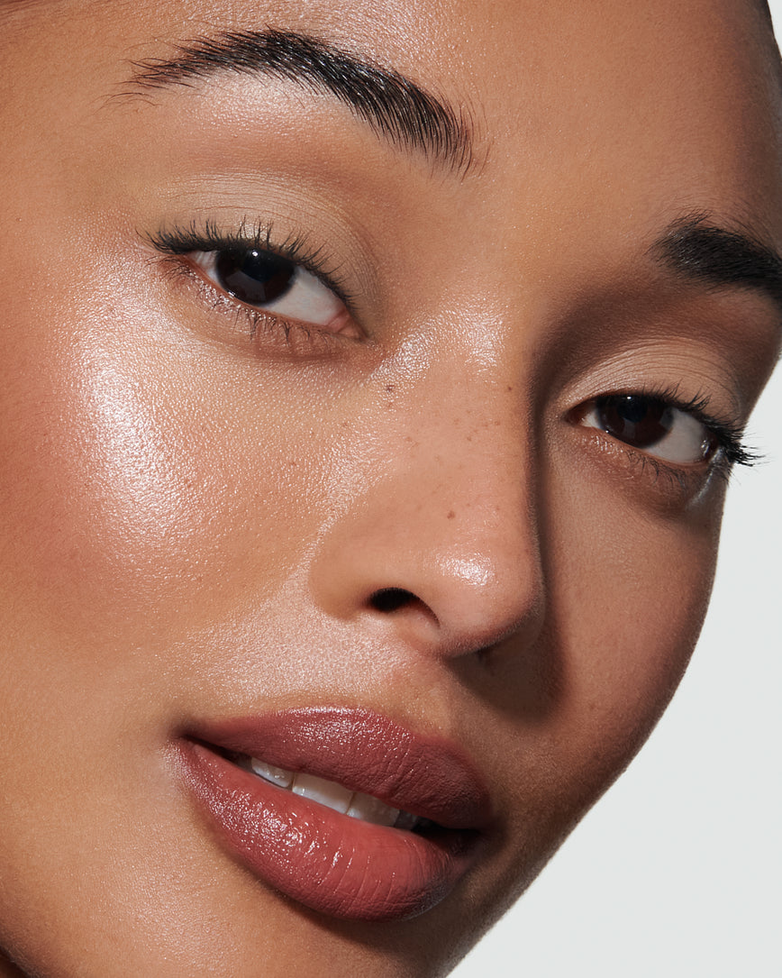 Portrait close-up of model wearing mauve beige Pheobe Liquid Silk eyeshadow