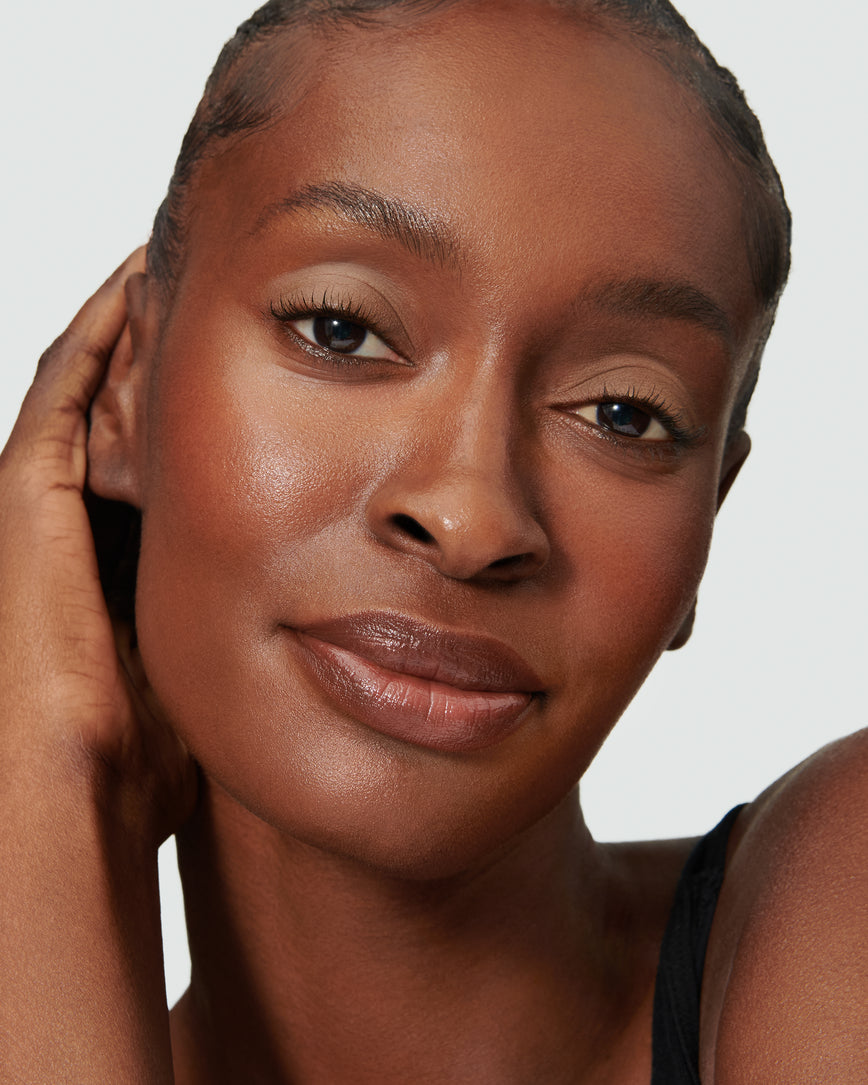 Portrait close-up of model wearing mauve beige Pheobe Liquid Silk eyeshadow