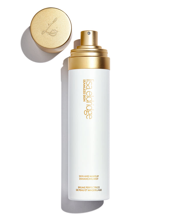 White bottle with gold lettering: Lisa Eldridge Skin and Makeup Enhancing Mist, with spray top and lid in gold primary_meta_image