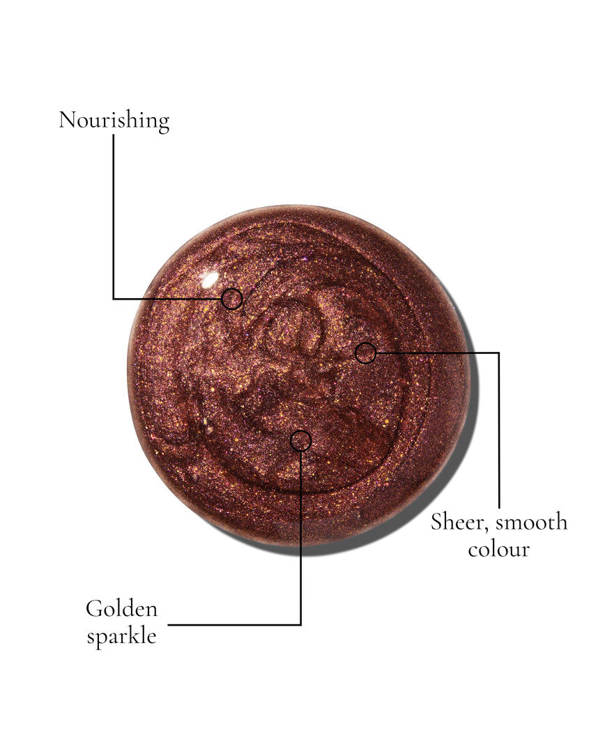 Kensington Plum Gloss Embrace Sequin swatch, a chocolatey plum berry with golden sparkle, with USPs: Nourishing, Shimmering lustre, Longwearing