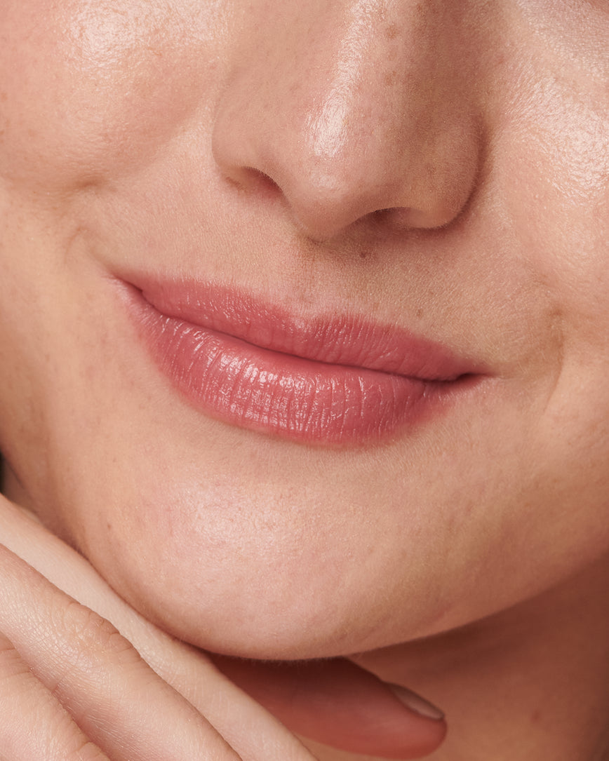 Extreme close up of model's lips, wearing Epanoui Baume Embrace