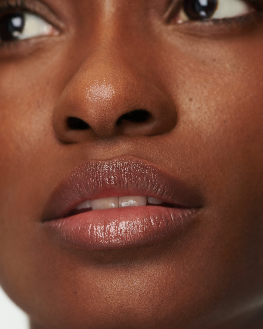 Extreme close up of model's lips, wearing Epanoui Baume Embrace
