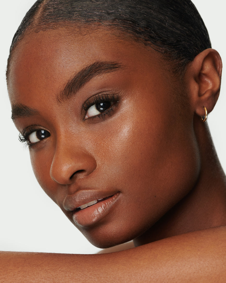 Portrait close-up of model wearing Meet Cute Baume Embrace