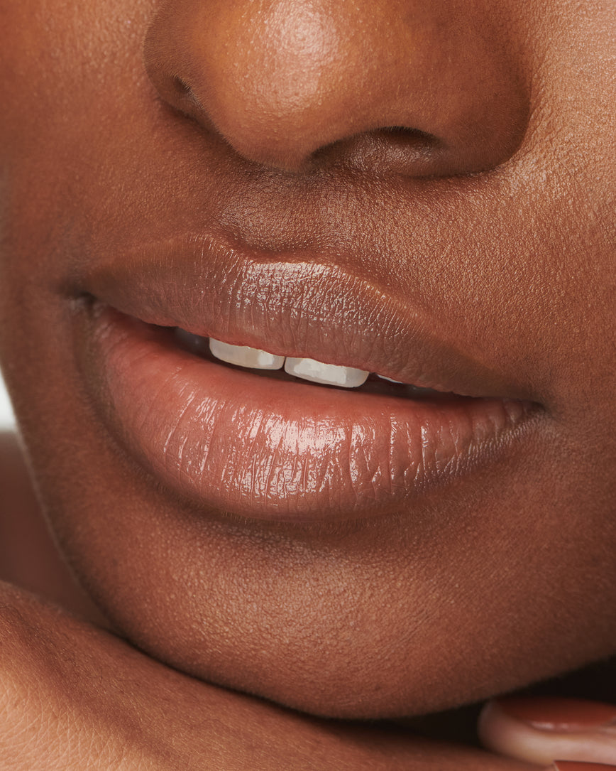 Extreme close up of model's lips, wearing Meet Cute Baume Embrace