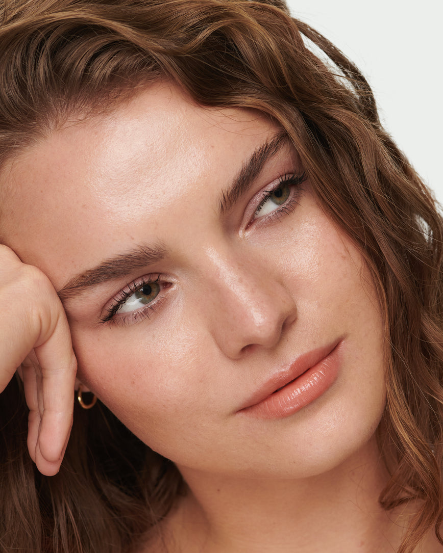 Portrait close-up of model wearing Meet Cute Baume Embrace