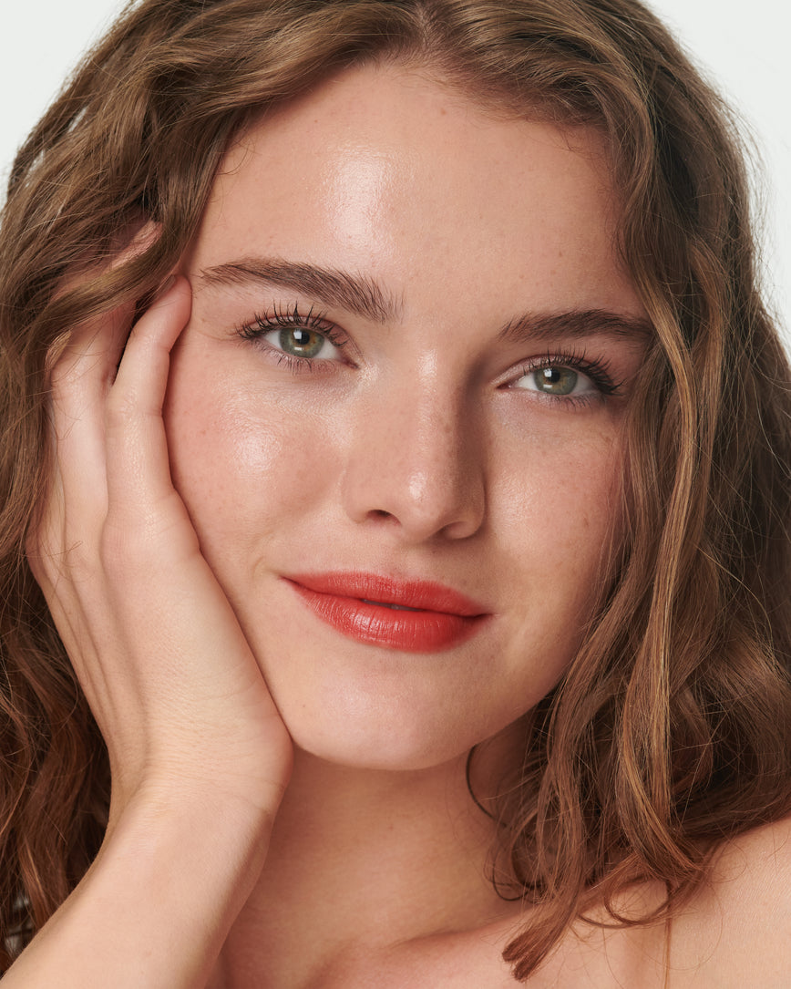 Portrait close-up of model wearing Red Curve Baume Embrace