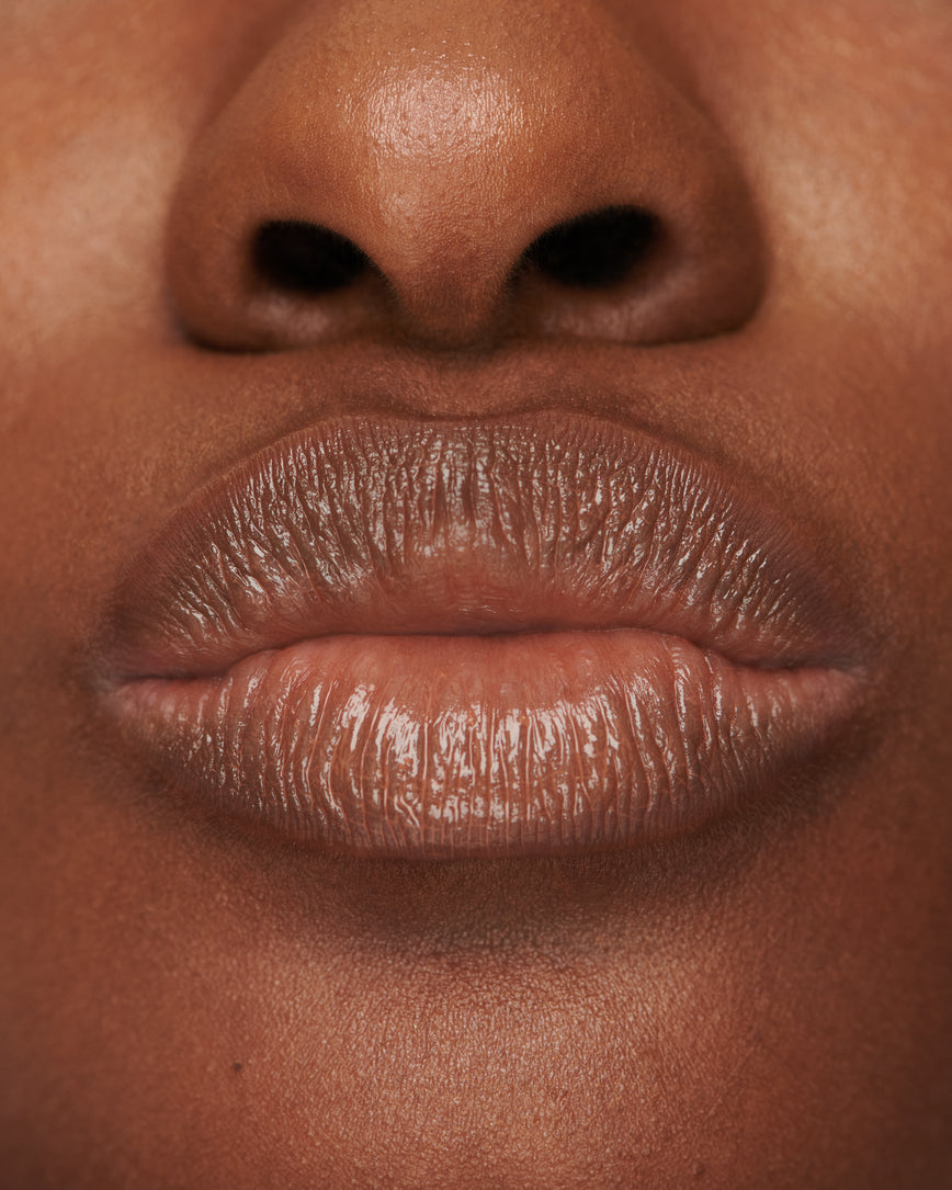Extreme close up of model's lips, wearing Sweet Fig Baume Embrace