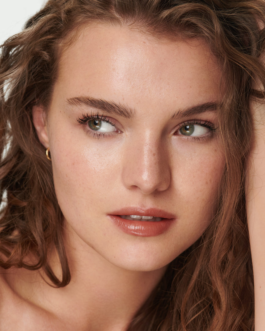 baumeimg Portrait close-up of model wearing Sweet Fig Baume Embrace