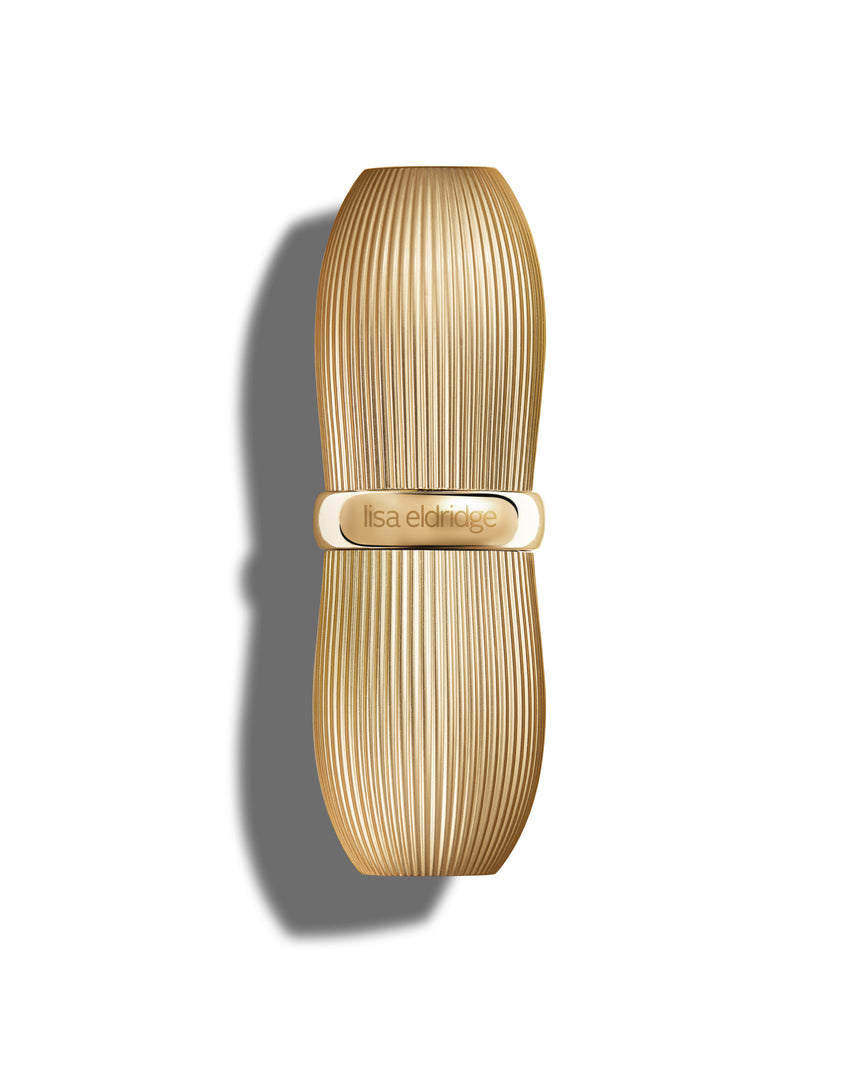Closed gold vintage-style lipstick casing with 'Lisa Eldridge' branding engraved
