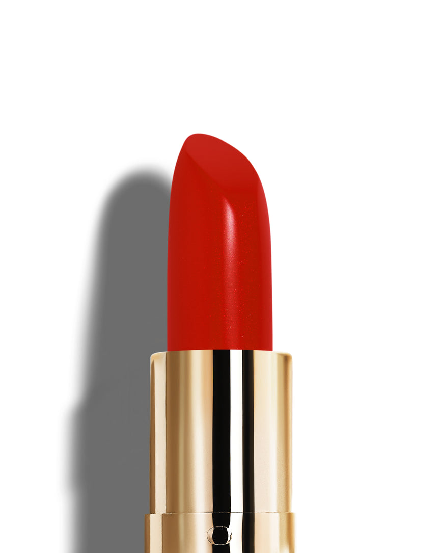 Scarlet Sequin lipstick bullet with gold casing on a white background