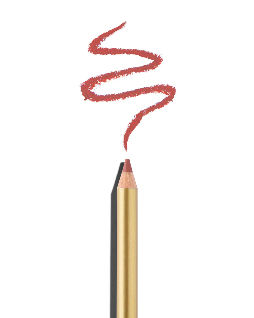 Light pink lip pencil tip close up with gold barrel, shown with a shade swatch at the pencil tip, demonstrating the product's tones and texture.