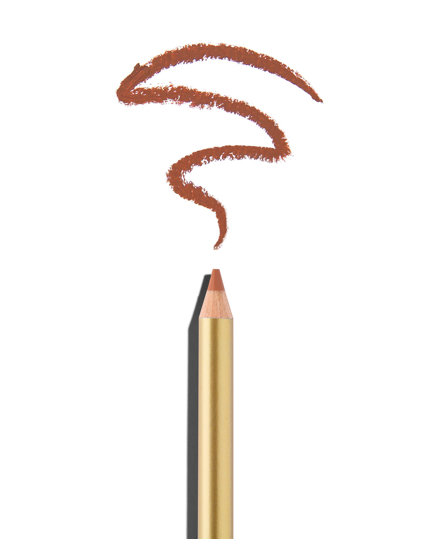 Peachy tan lip pencil tip close up with gold barrel, shown with a shade swatch at the pencil tip, demonstrating the product's tones and texture.