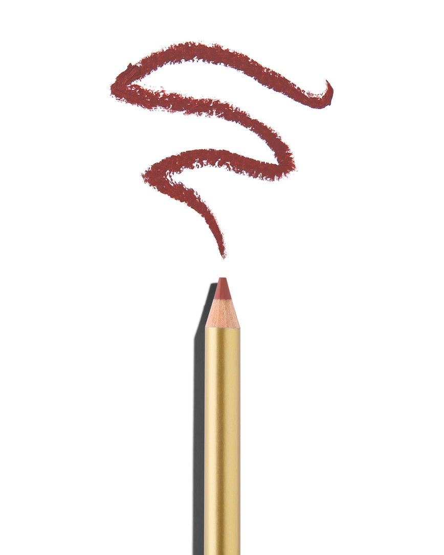 Mauve pink lip pencil tip close up with gold barrel, shown with a shade swatch at the pencil tip, demonstrating the product's tones and texture.