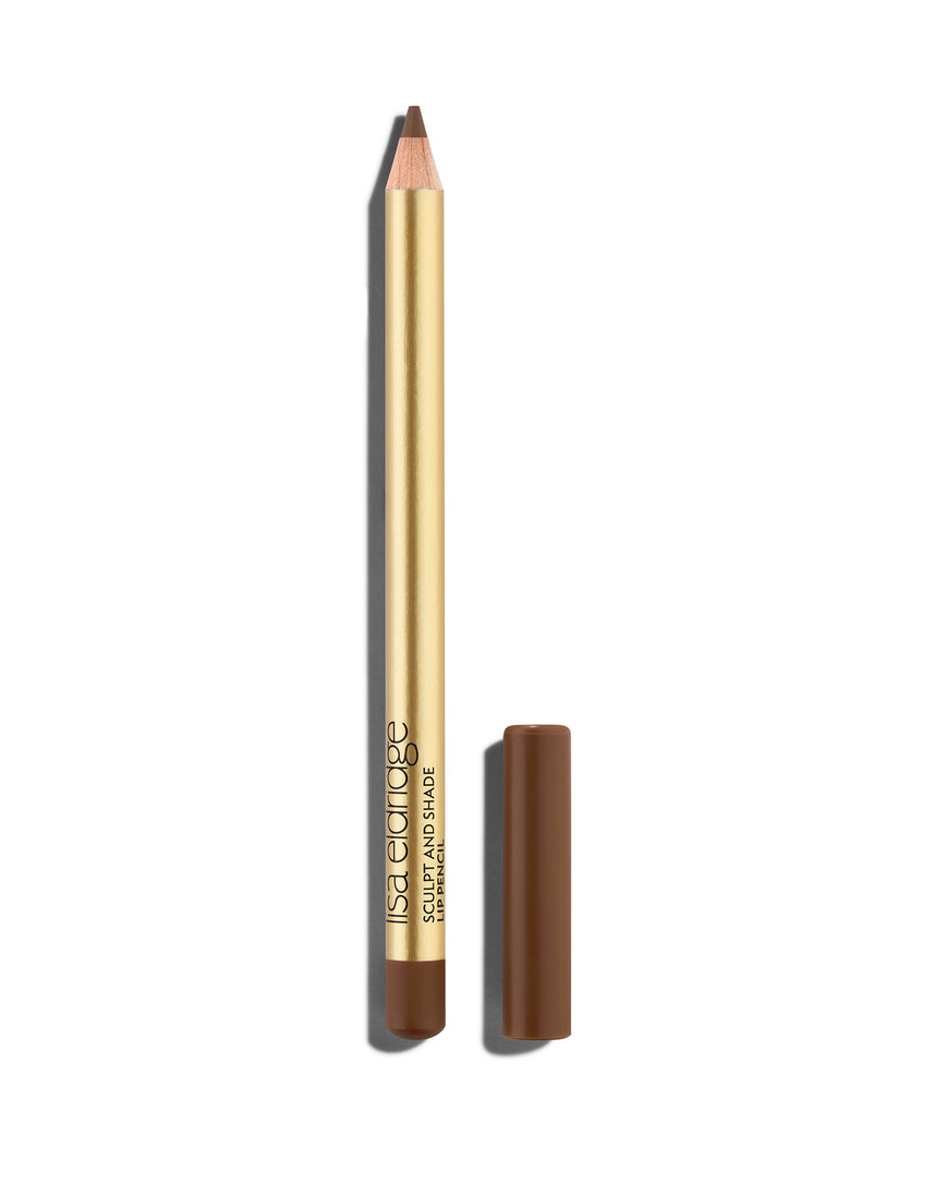 Cork brown lip pencil with gold barrel and shade-matching cap, shown on a white background