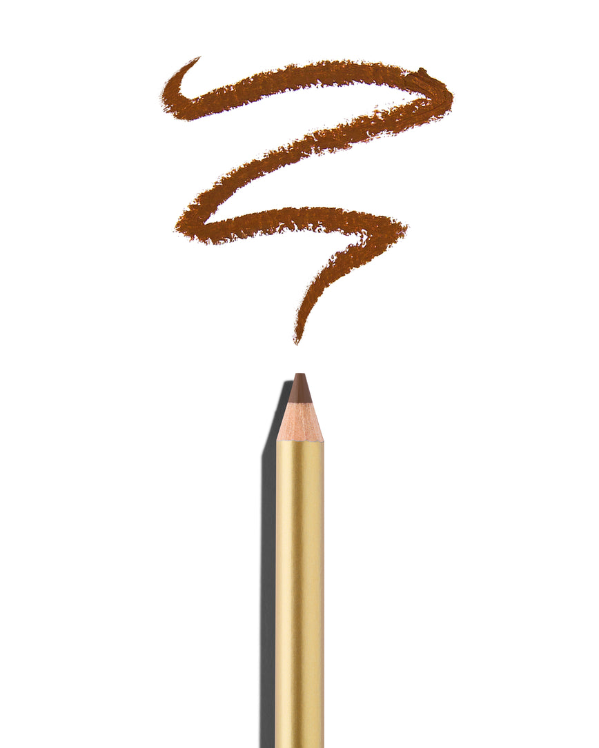 Cork brown lip pencil tip close up with gold barrel, shown with a shade swatch at the pencil tip, demonstrating the product's tones and texture.