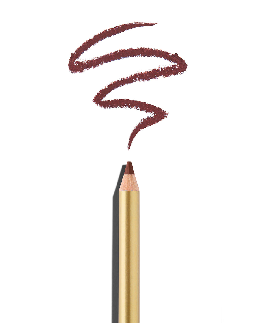 'Dirty' berry lip pencil tip close up with gold barrel, shown with a shade swatch at the pencil tip, demonstrating the product's tones and texture.