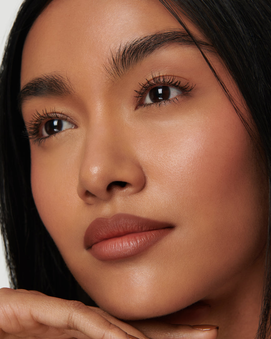 Portrait close-up of model wearing 1N Sculpt and Shade Lip Pencil 