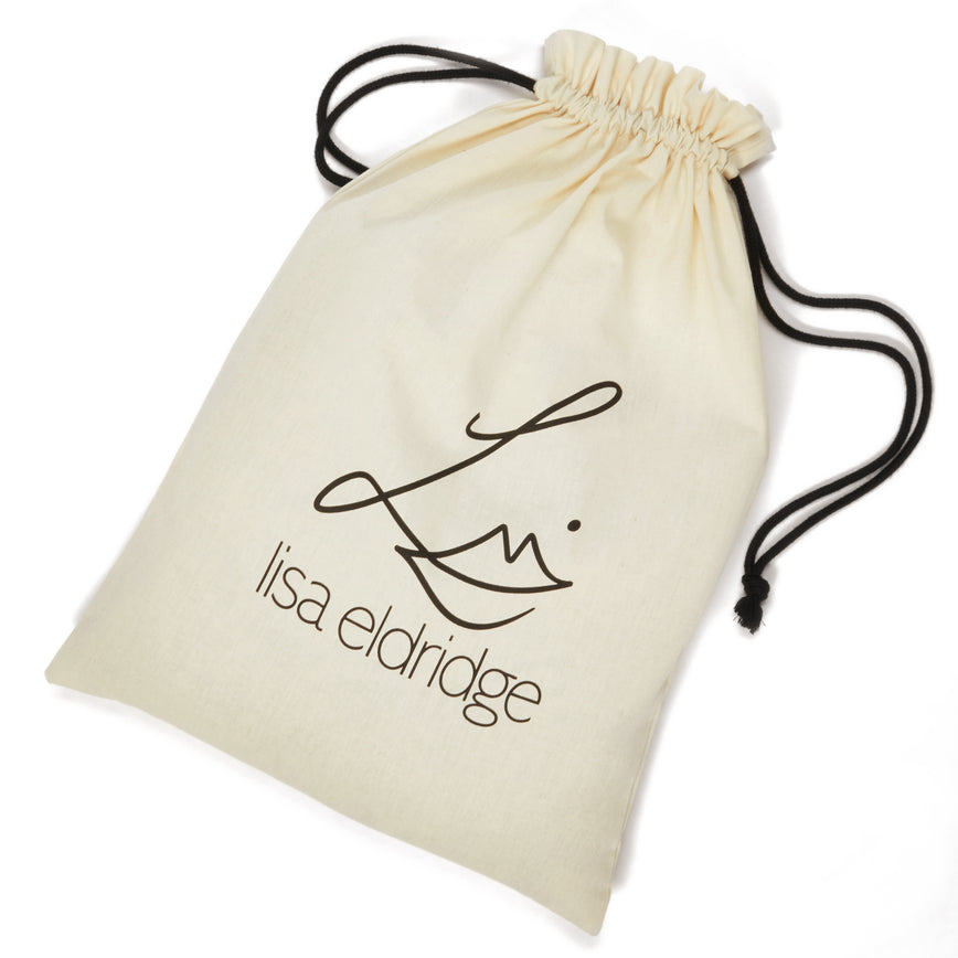 Cream drawstring bag for the sweatshirt, it has the Lisa Eldridge logo on the front and uses black cord.
