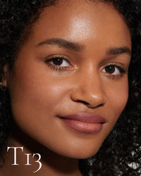 block The white pod packaging of Seamless Skin Enhancing Tint by Lisa Eldridge