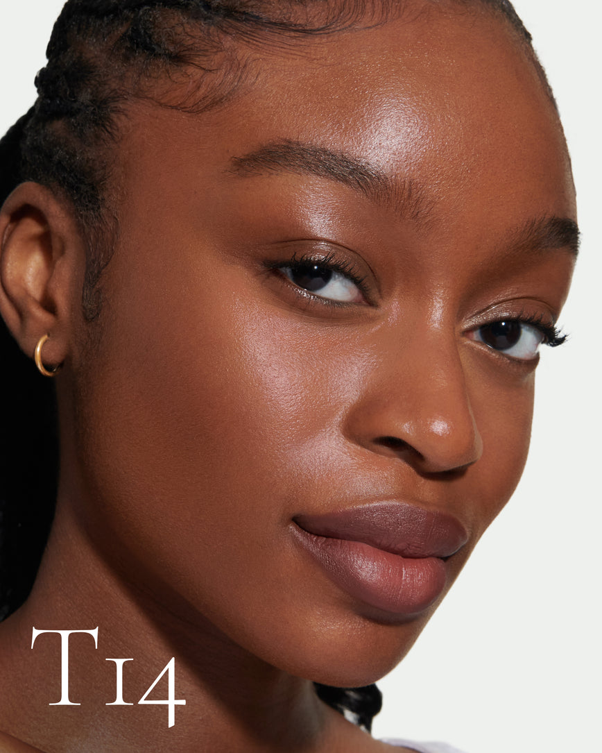 numbered Close up portrait of model wearing T14 with text displaying so