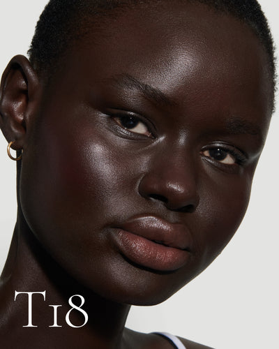 numbered howtouse Close up portrait of model wearing T18 with text displaying so