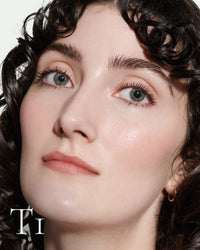 block The white pod packaging of Seamless Skin Enhancing Tint by Lisa Eldridge