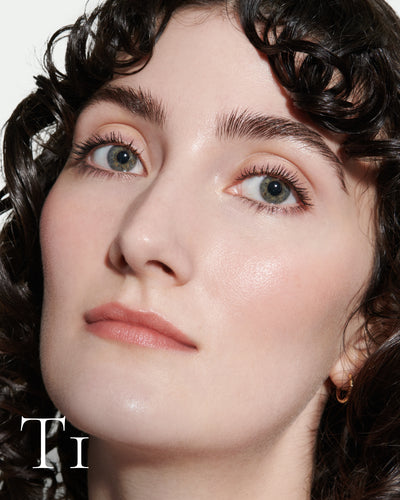 numbered howtouse Close up portrait of model wearing T1 with text displaying so