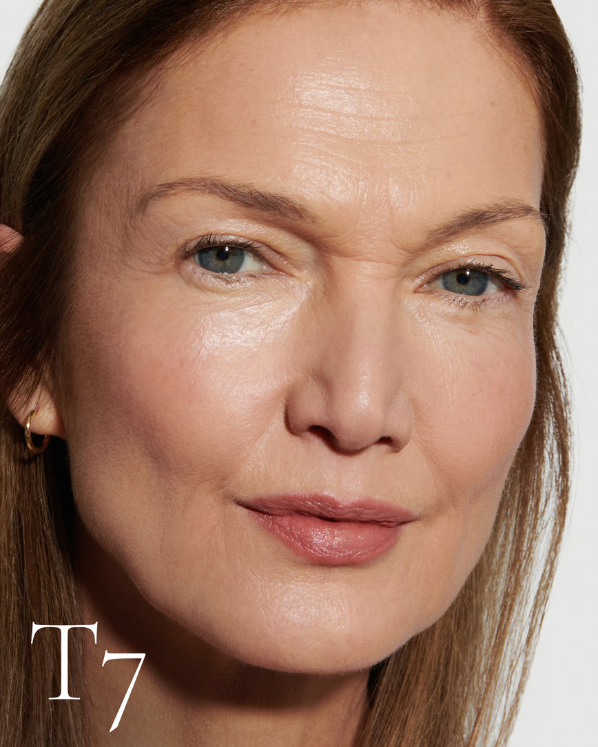 Close up portrait of model wearing T7 with text displaying so