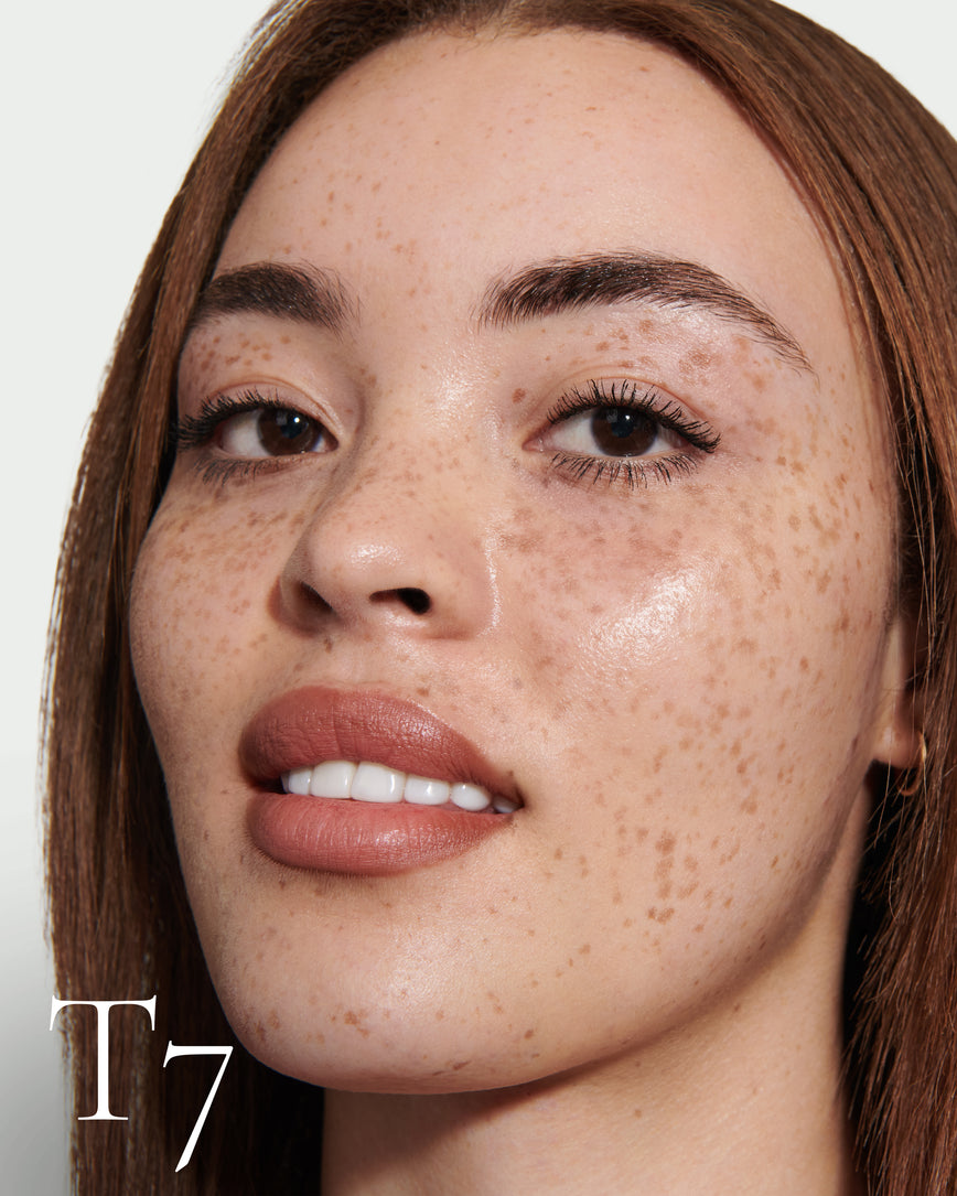 Close up portrait of model wearing T7 with text displaying so