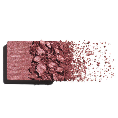 Makeup eyeshadow refill with warm rose powder on a white background